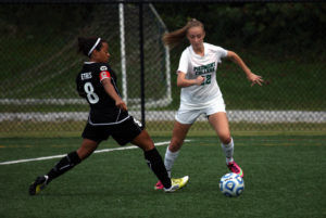 Freshman Caitlyn Dove dribbles around the Oglethorpe defense