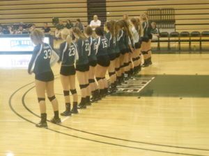 The Lady Lions Volleyball team prepared for the match.