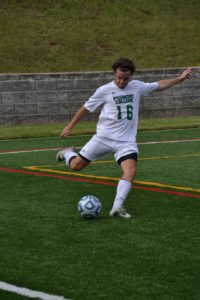 Sean Melton clears the ball from the Lion’s territory.