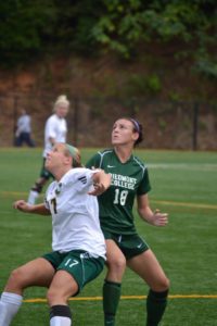 Freshman Megan Hatfield battles for the header.