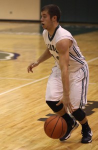 Sophomore Austin Thomas dribbles past the defense in last seasons game.