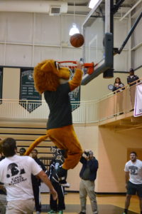 The PC Lion mascot participates in the dunk contest.