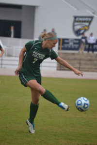 Lindsey Nichols traps the ball at her feet.
