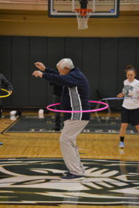 Piedmont Athletic Director, John Dzik, participates in the hula hoop contest.