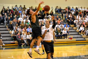 Carl Allen goes up for a lay up in the seniors vs. graduate assistant games